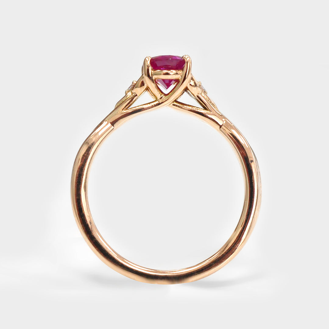 18K gold Oval Ruby and Two Side Diamonds Ring