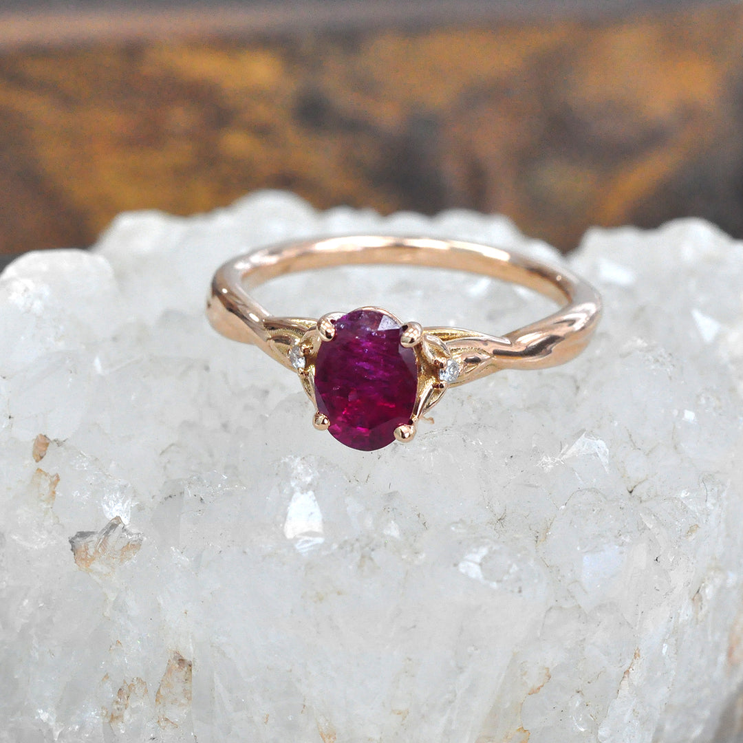 18K gold Oval Ruby and Two Side Diamonds Ring