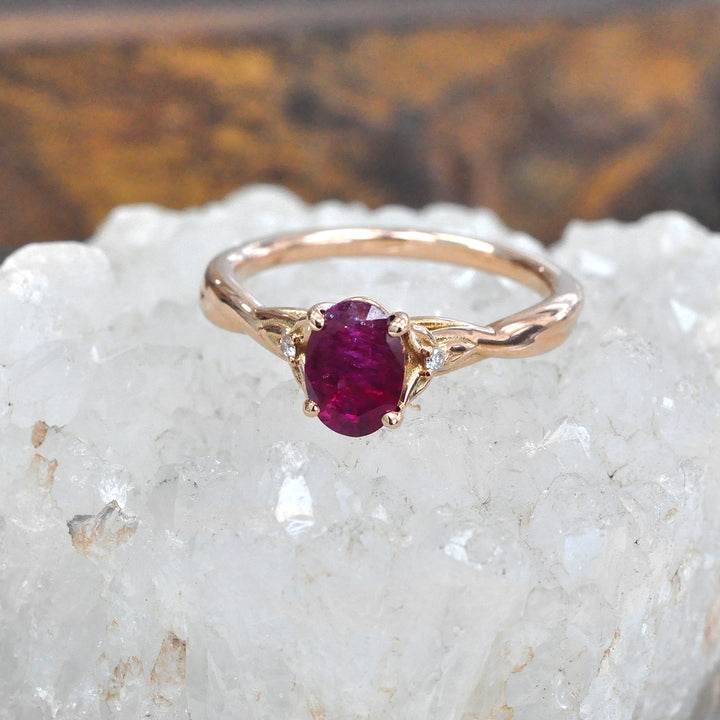 18K gold Oval Ruby and Two Side Diamonds Ring