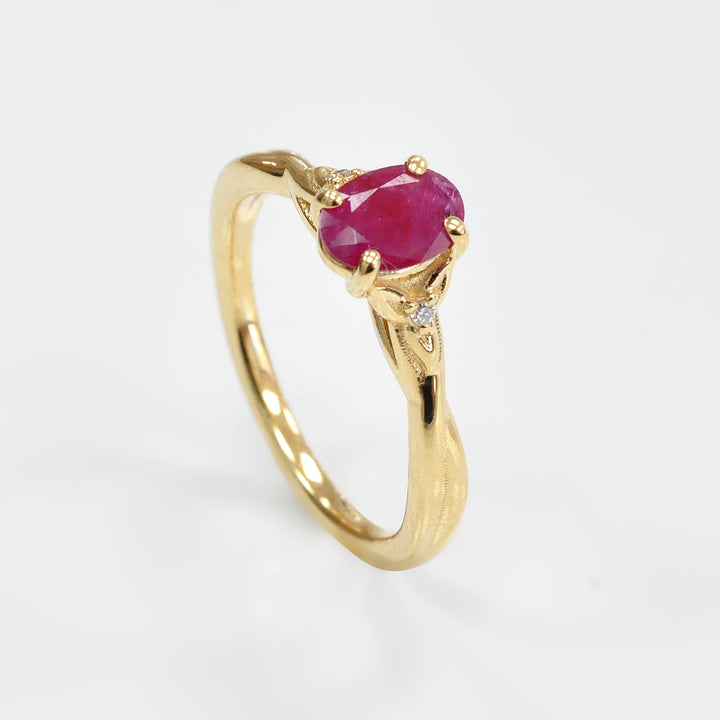 Ruby and Two small Side Diamonds Ring in 18K Yellow Gold
