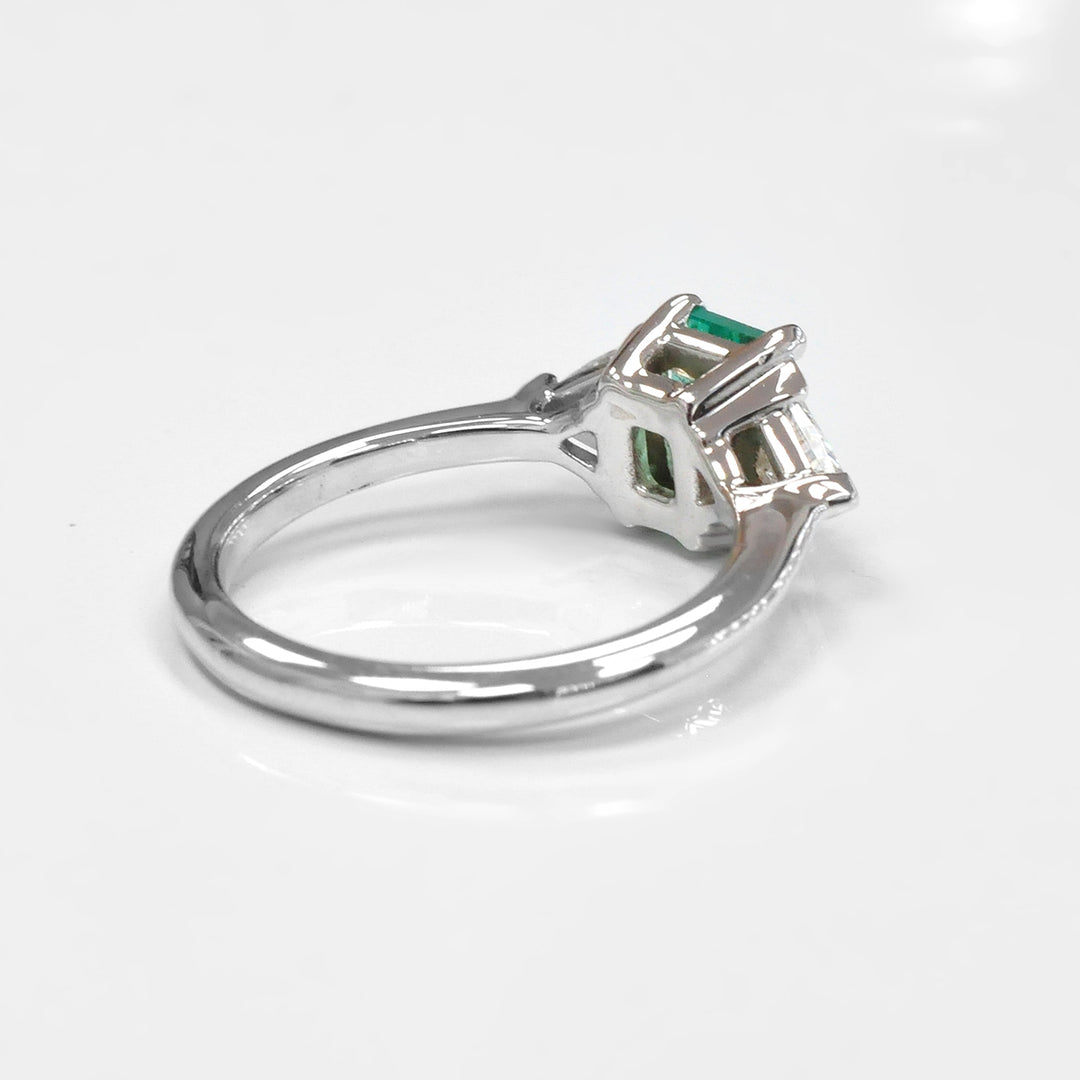 Natural Emerald and Two Side Trilliant Diamonds Ring