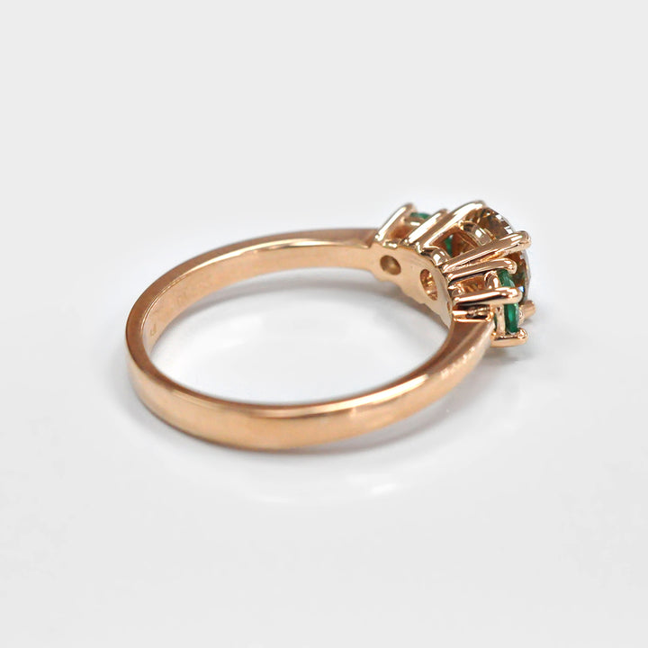 Round Diamond and Pair of Green Emeralds Ring