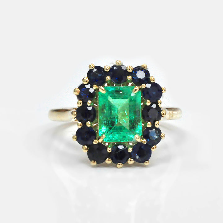 Emerald and Blue Sapphires Halo Ring in Yellow Gold