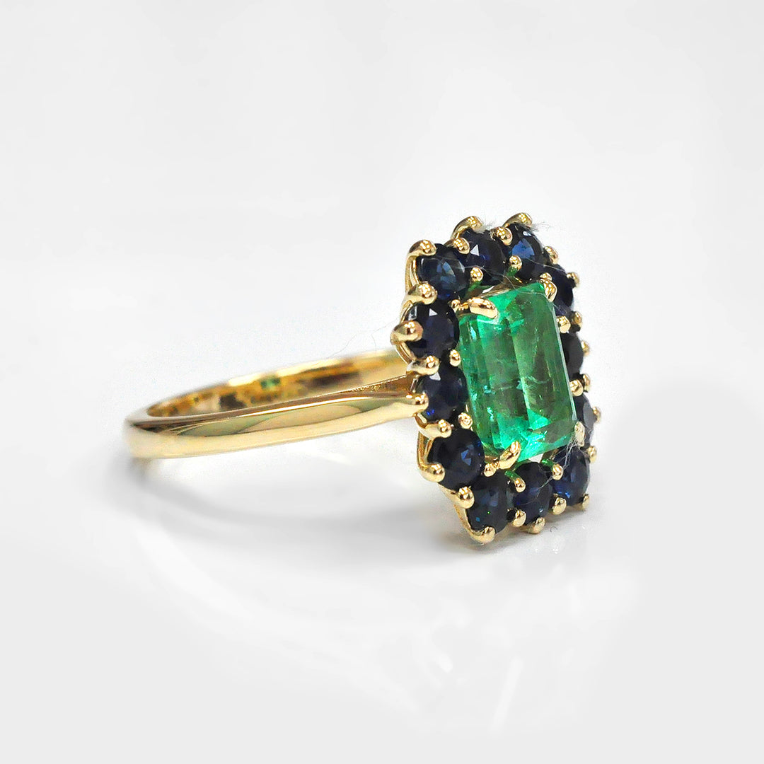 Emerald and Blue Sapphires Halo Ring in Yellow Gold