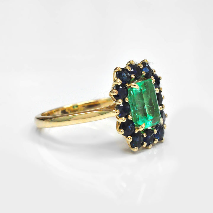 Emerald and Blue Sapphires Halo Ring in Yellow Gold