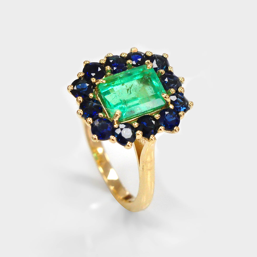 Emerald and Blue Sapphires Halo Ring in Yellow Gold