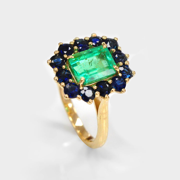 Emerald and Blue Sapphires Halo Ring in Yellow Gold