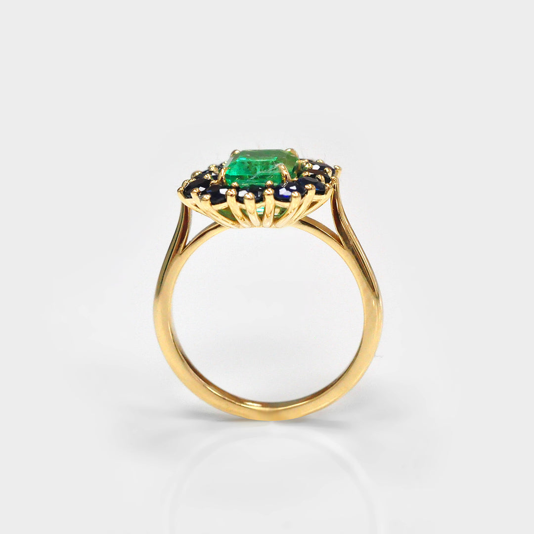 Emerald and Blue Sapphires Halo Ring in Yellow Gold