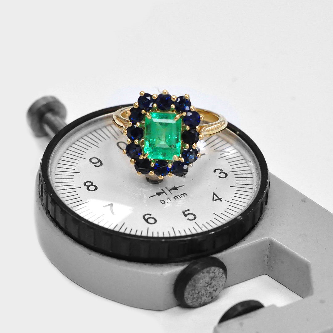 Emerald and Blue Sapphires Halo Ring in Yellow Gold