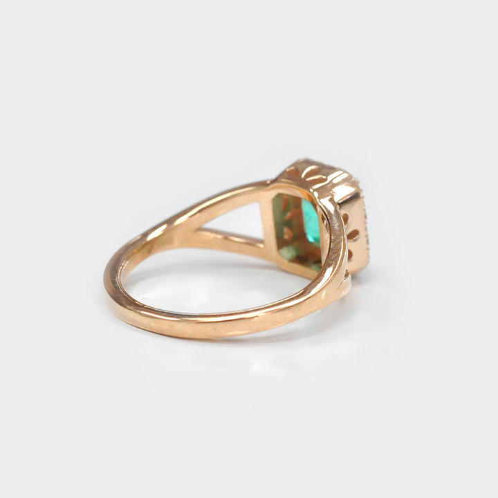 Green Emerald Split Shank And Diamonds Halo Rose Gold Ring