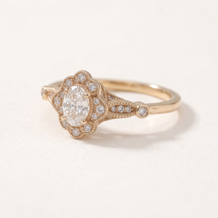 Vintage oval diamond halo ring in 14K rose gold / טבעת יהלום אובלי בהילה בסגנון וינטג׳ בזהב ורוד 14K - Angled view / מבט אלכסוני