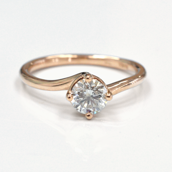 0.62 carat diamond rose gold solitaire engagement ring
