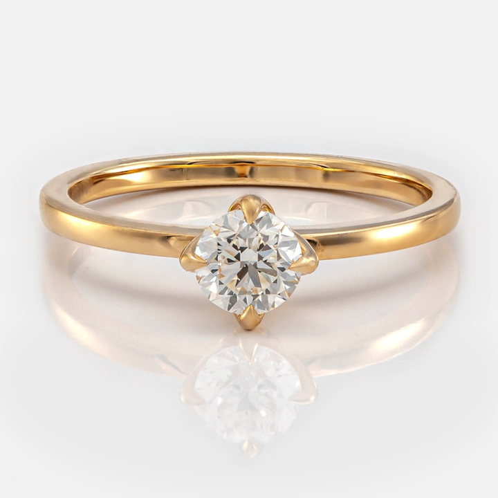 Delicate 4 prongs half carat diamond solitaire
