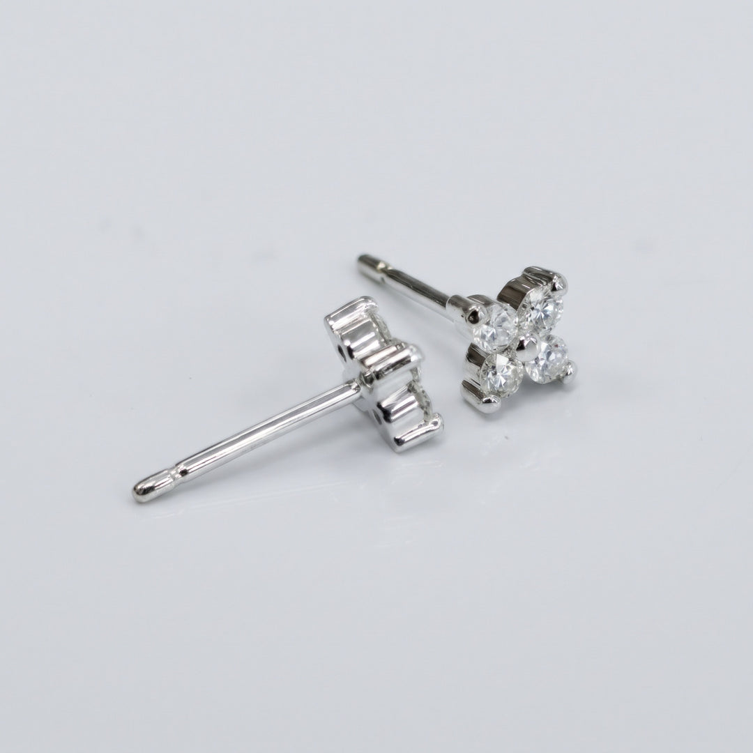 Natural diamond flower stud earrings in 14K white gold — side and setting detail
