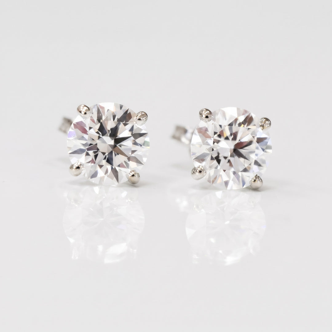 Lightweight martini natural diamond stud earrings in 14K white gold — front view
