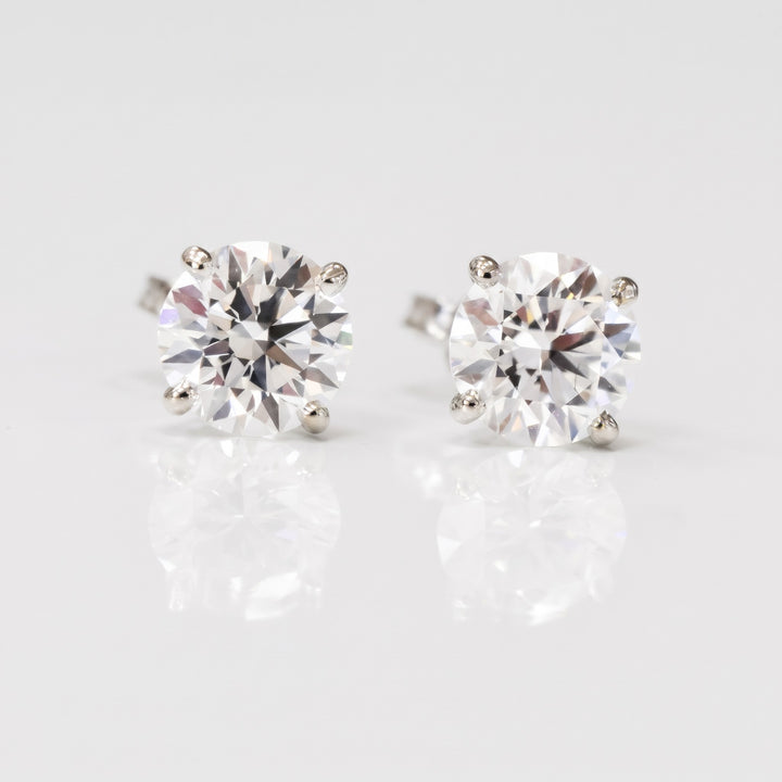 Lightweight martini natural diamond stud earrings in 14K white gold — front view