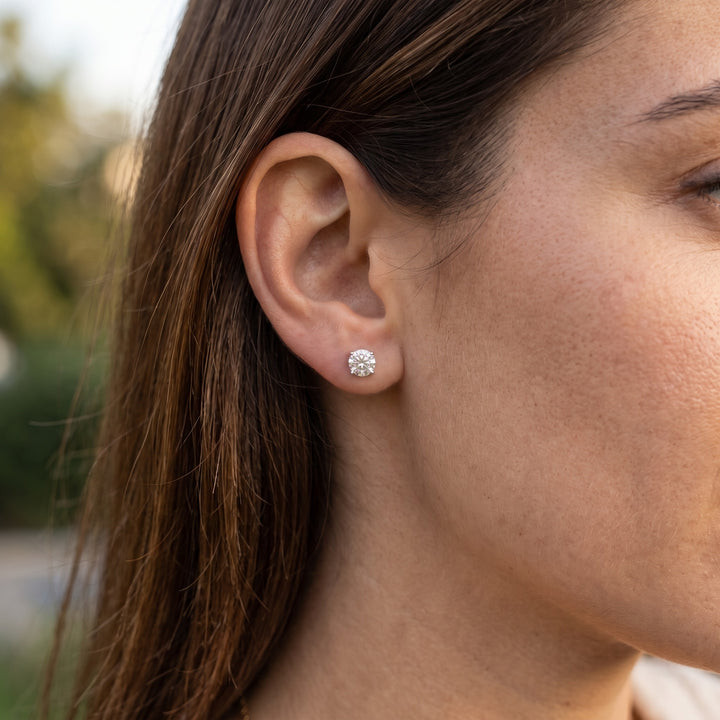 Lightweight martini natural diamond stud earring in 14K white gold — worn on ear