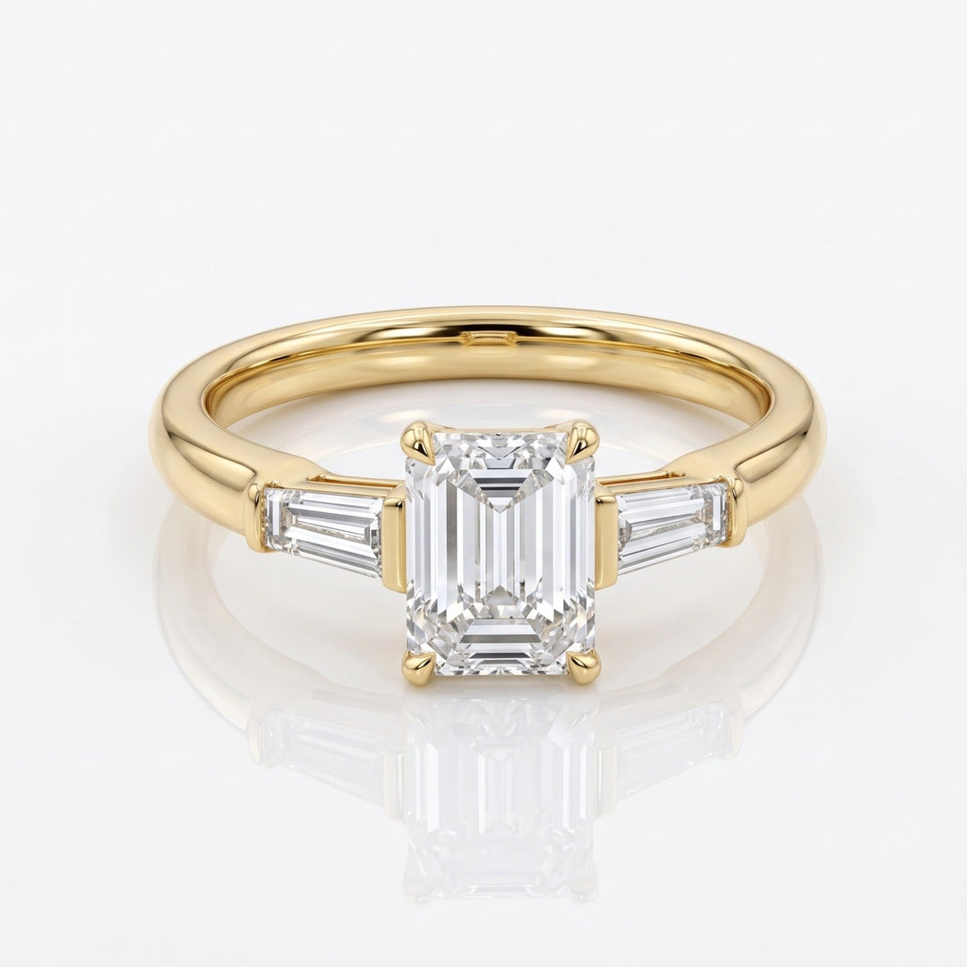 Front view of a 1.50 ct emerald-cut natural diamond three-stone ring in 14K yellow gold