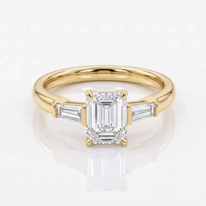 Front view of a 1.50 ct emerald-cut natural diamond three-stone ring in 14K yellow gold