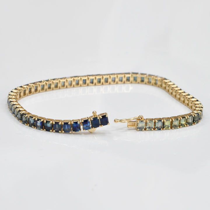 Emerald cut sapphire green to blue bracelet