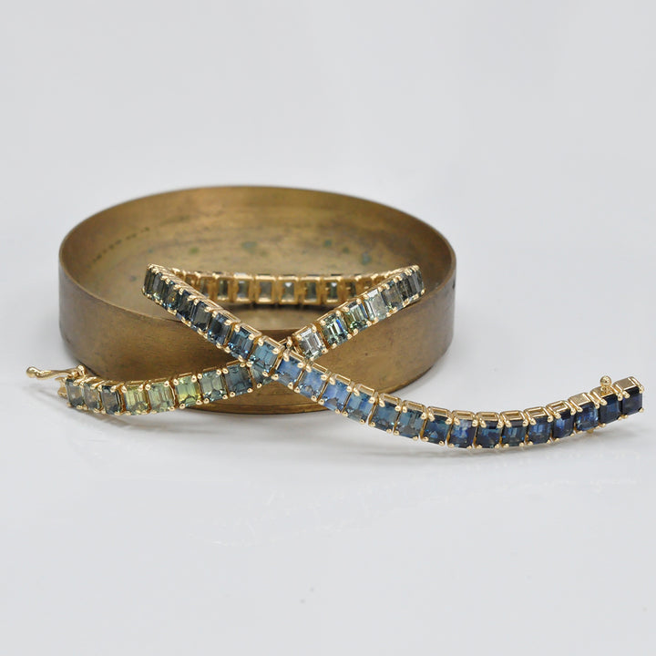 Emerald cut sapphire green to blue bracelet