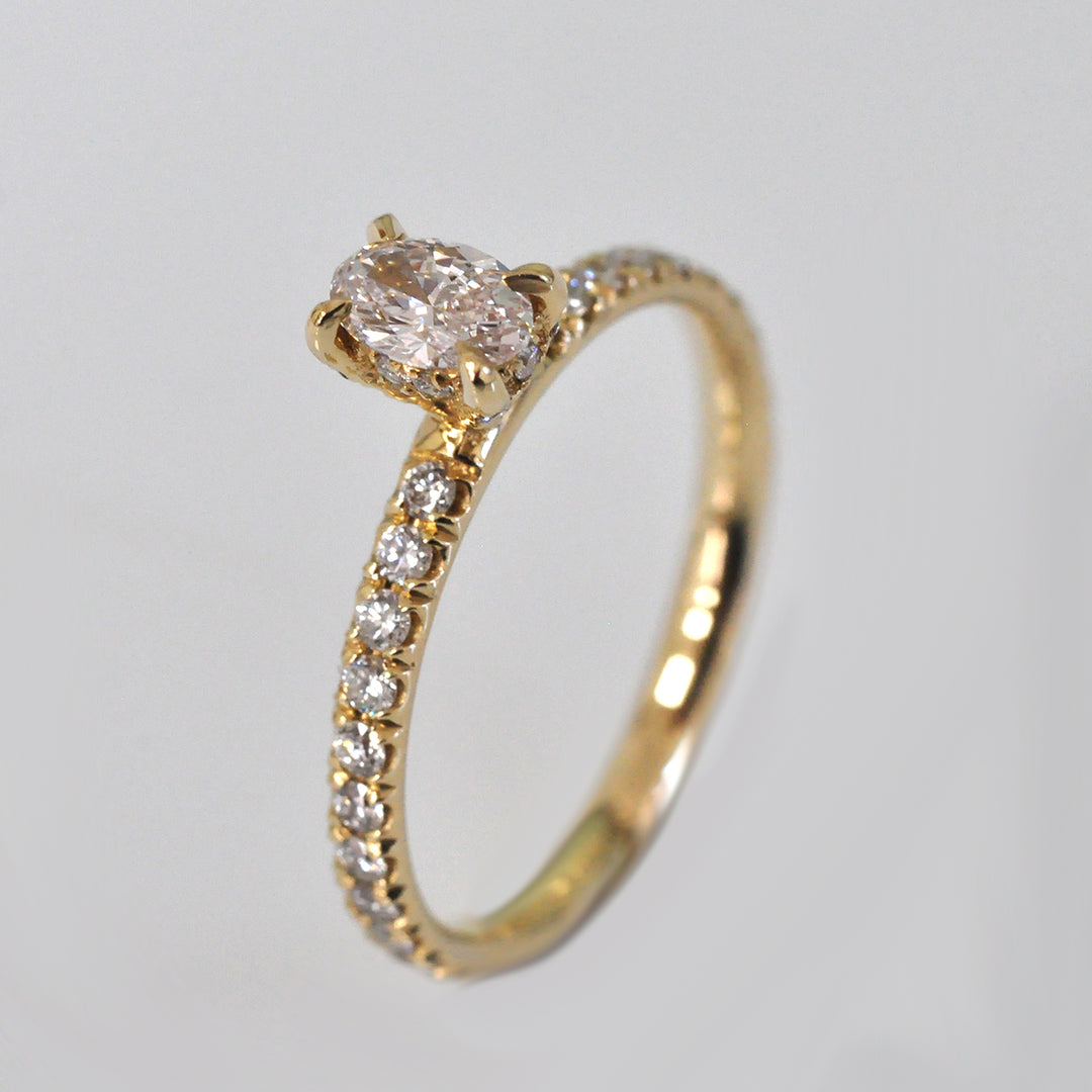 0.30 ct faint pink oval diamond yellow gold engagement ring