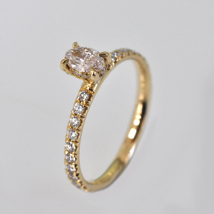 0.30 ct faint pink oval diamond yellow gold engagement ring
