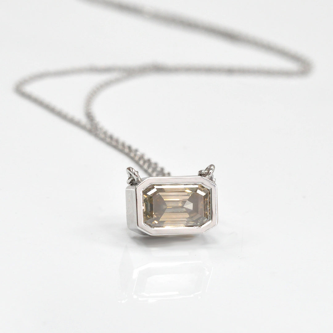 bezel set emerald cut brown diamond pendant