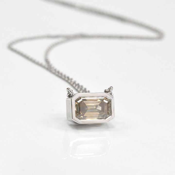 bezel set emerald cut brown diamond pendant