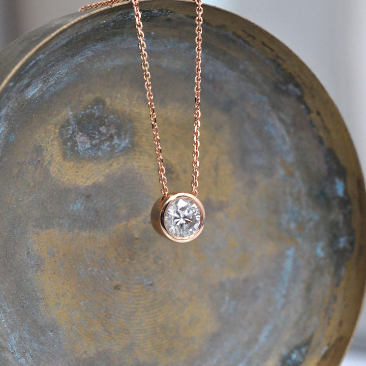 Rose gold bezel set diamond pendant