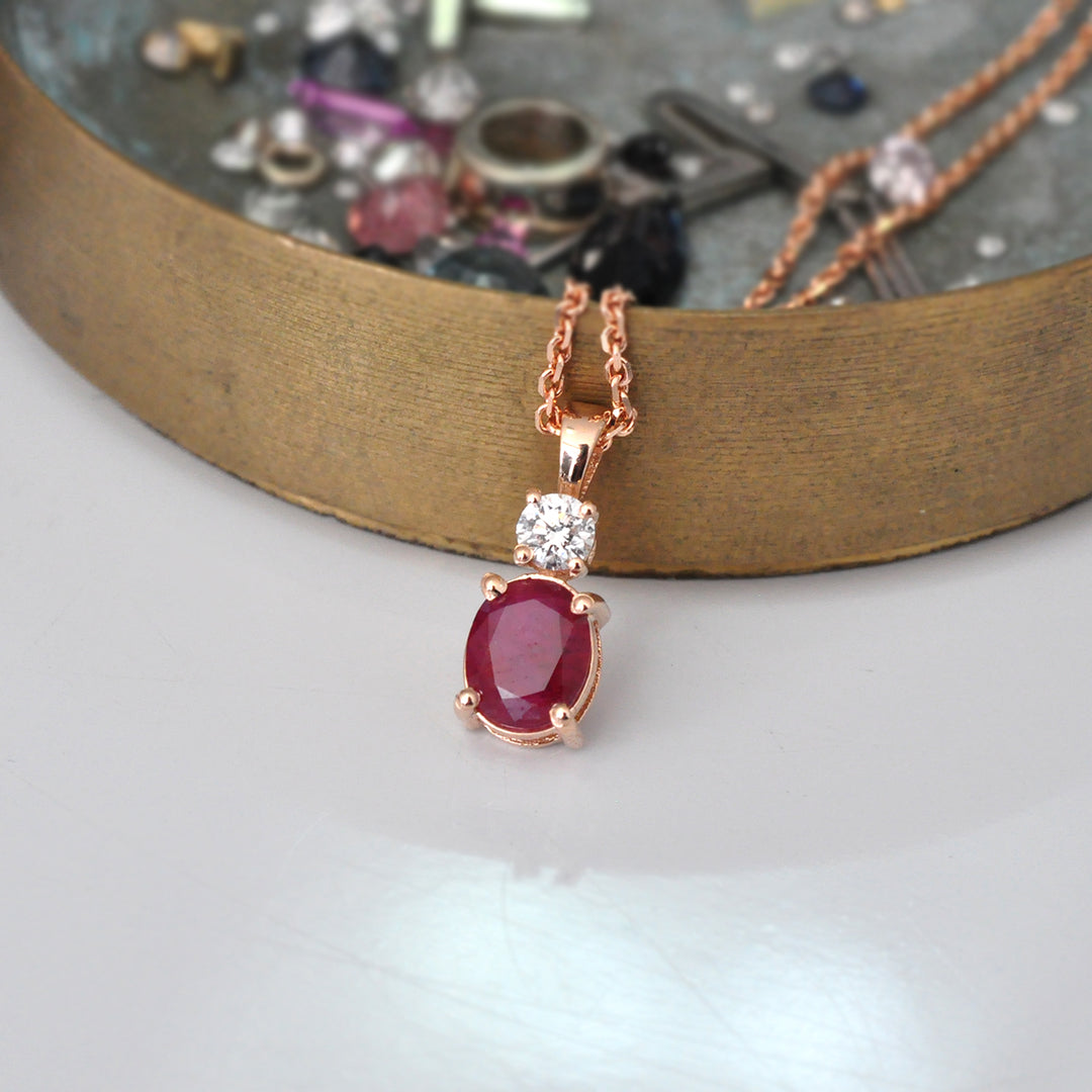 Oval Ruby and white Diamond pendant