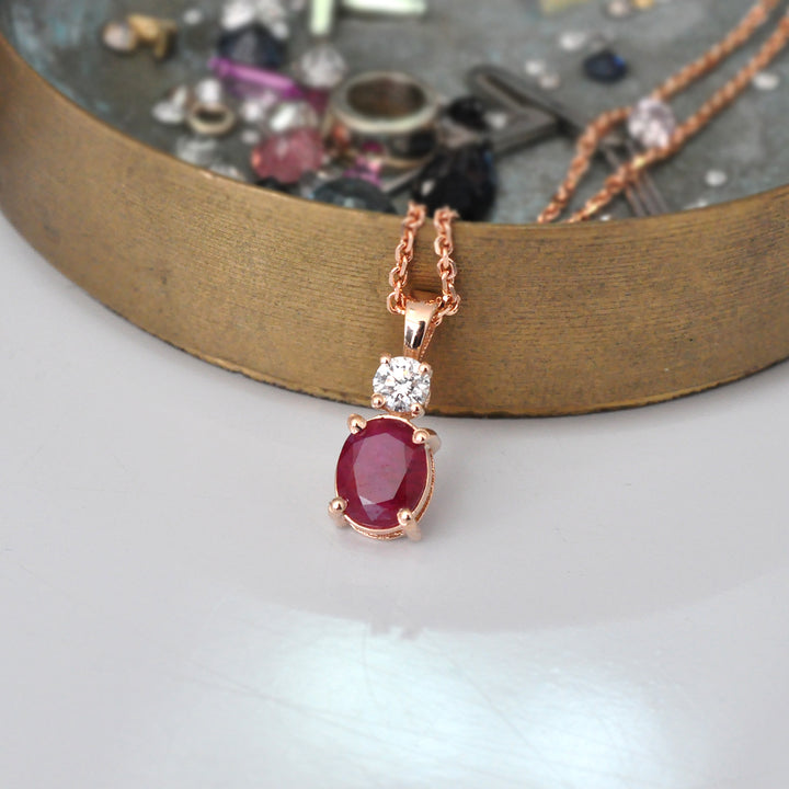 Oval Ruby and white Diamond pendant