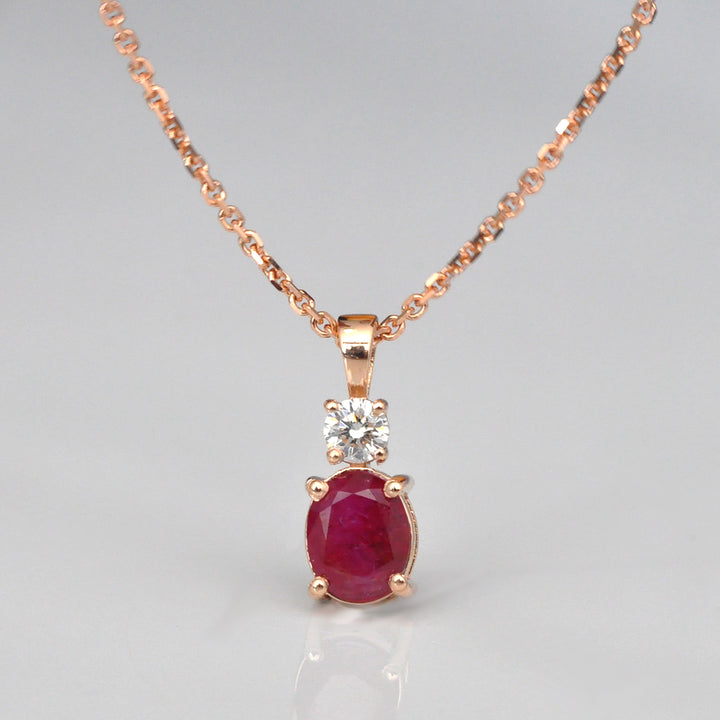 Oval Ruby and white Diamond pendant