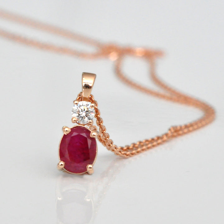 Oval Ruby and white Diamond pendant