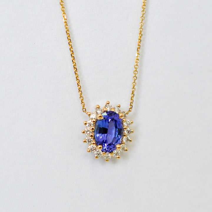 Blue sapphire and Yellow gold Halo Pendant