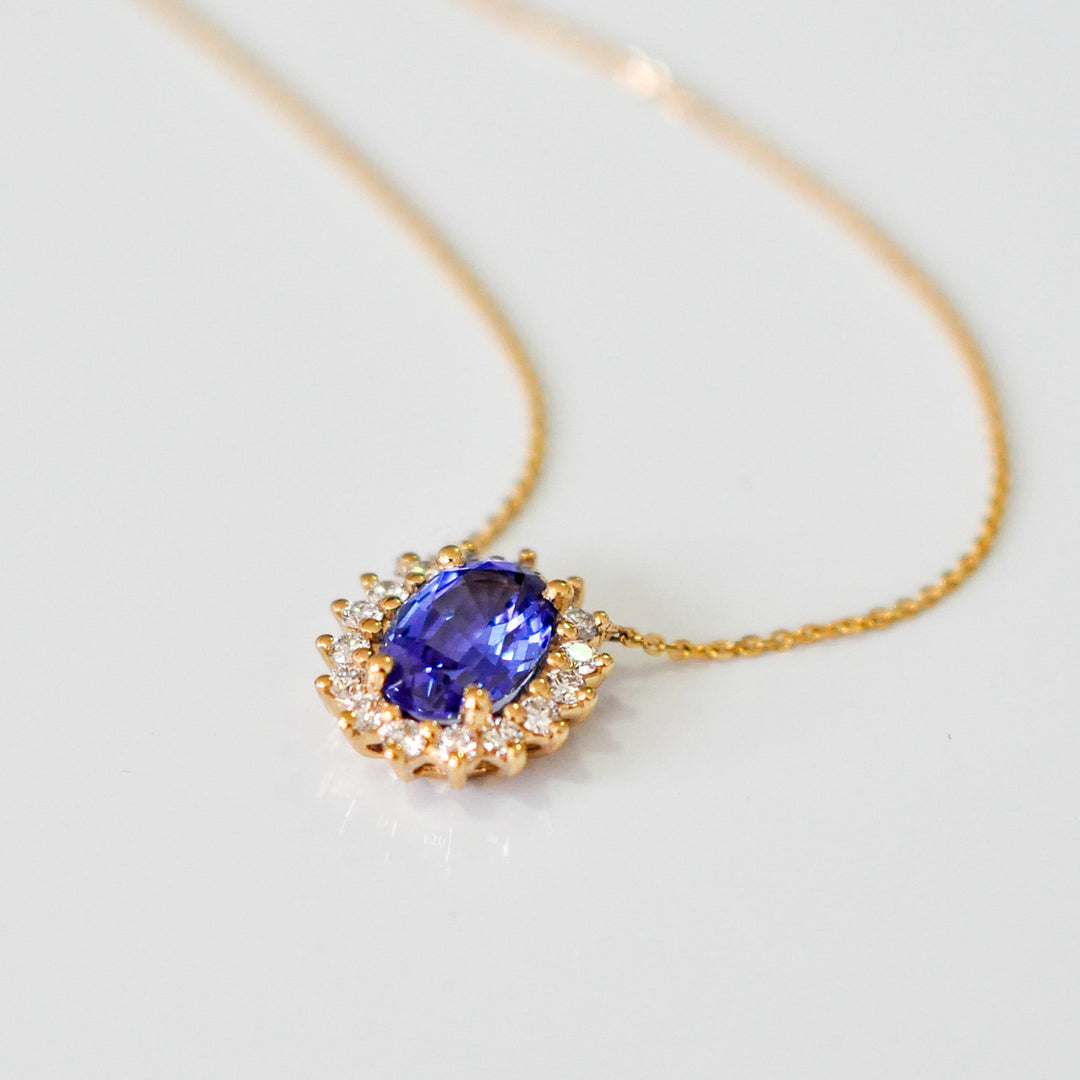 Blue sapphire and Yellow gold Halo Pendant