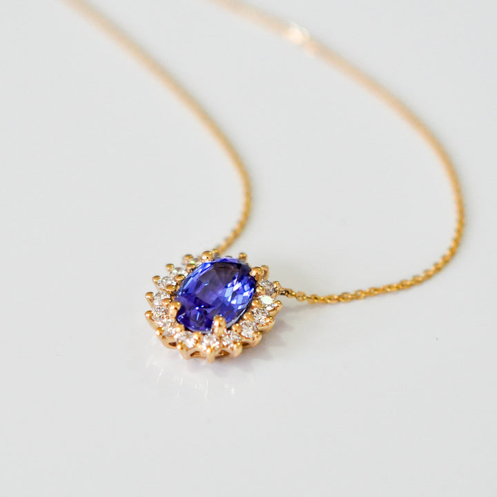 Blue sapphire and Yellow gold Halo Pendant
