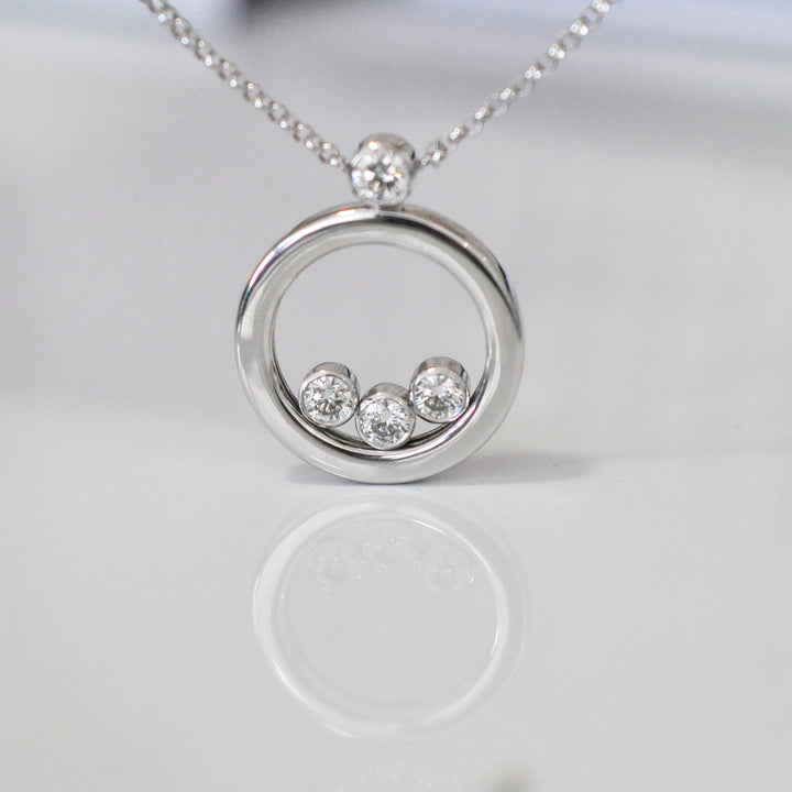 white Gold Circle 4 diamonds pendant