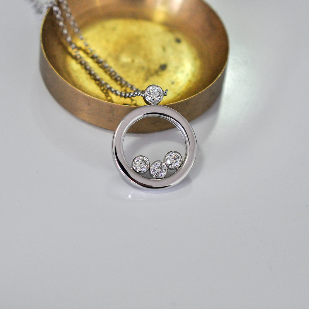 white Gold Circle 4 diamonds pendant