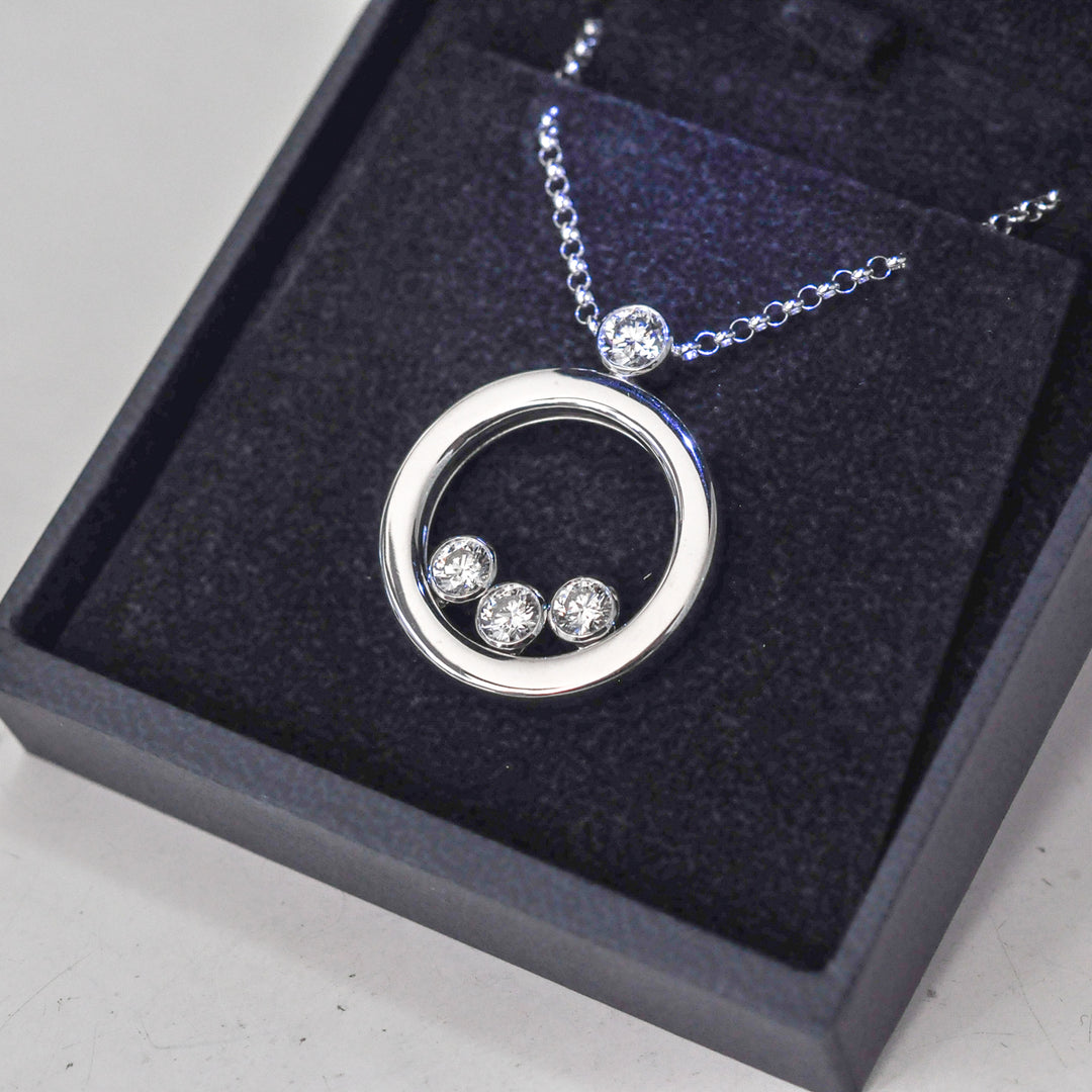 white Gold Circle 4 diamonds pendant
