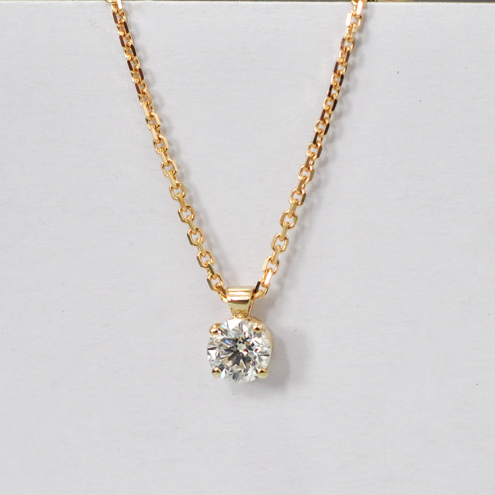 delicate low bail yellow gold solitaire diamond pendant