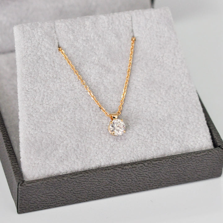 delicate low bail yellow gold solitaire diamond pendant