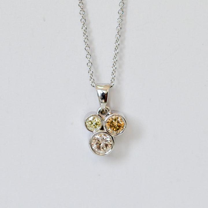 three fancy color diamonds bezel set pendant