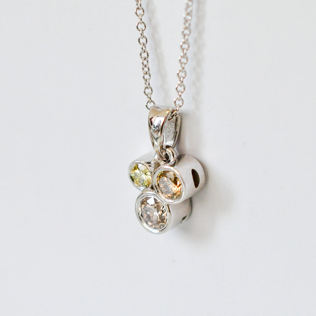 three fancy color diamonds bezel set pendant