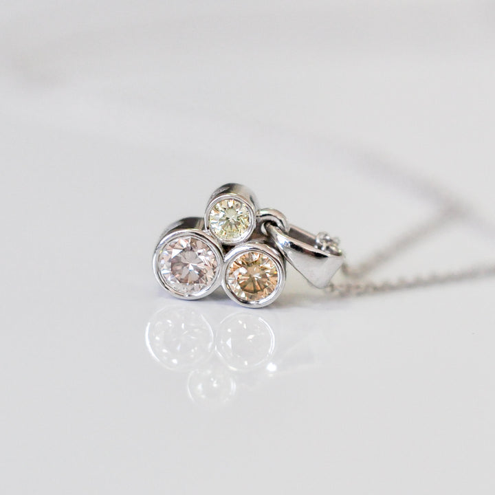 three fancy color diamonds bezel set pendant