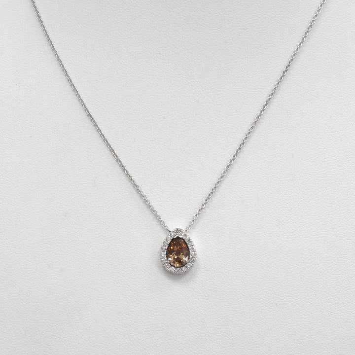 pear shape fancy brown and white diamonds halo pendant.