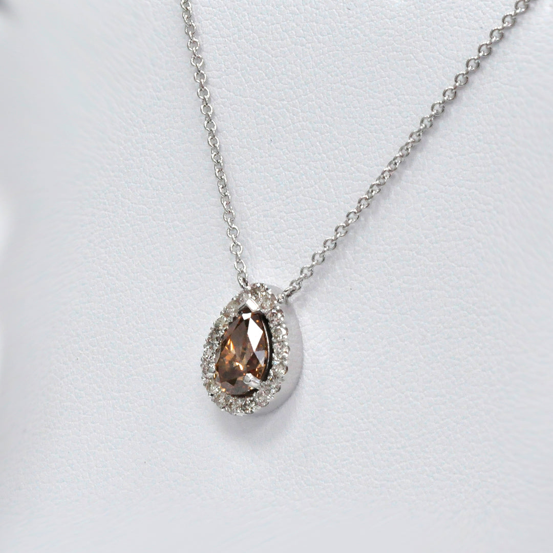 pear shape fancy brown and white diamonds halo pendant.