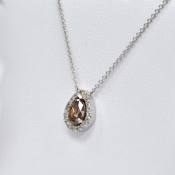 pear shape fancy brown and white diamonds halo pendant.