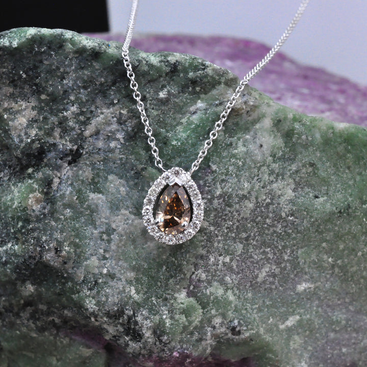 pear shape fancy brown and white diamonds halo pendant.