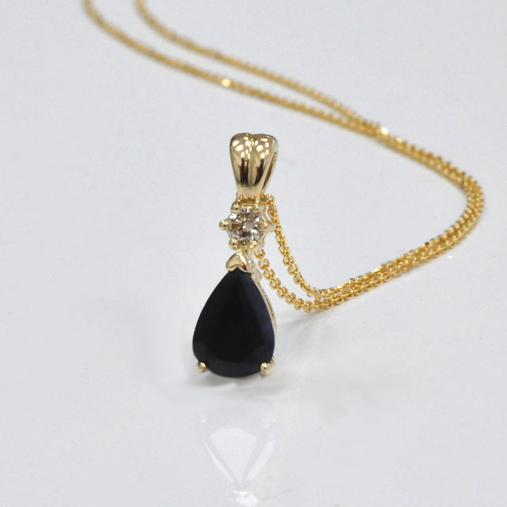 Pear Shape black sapphire and champagne Diamond pendant